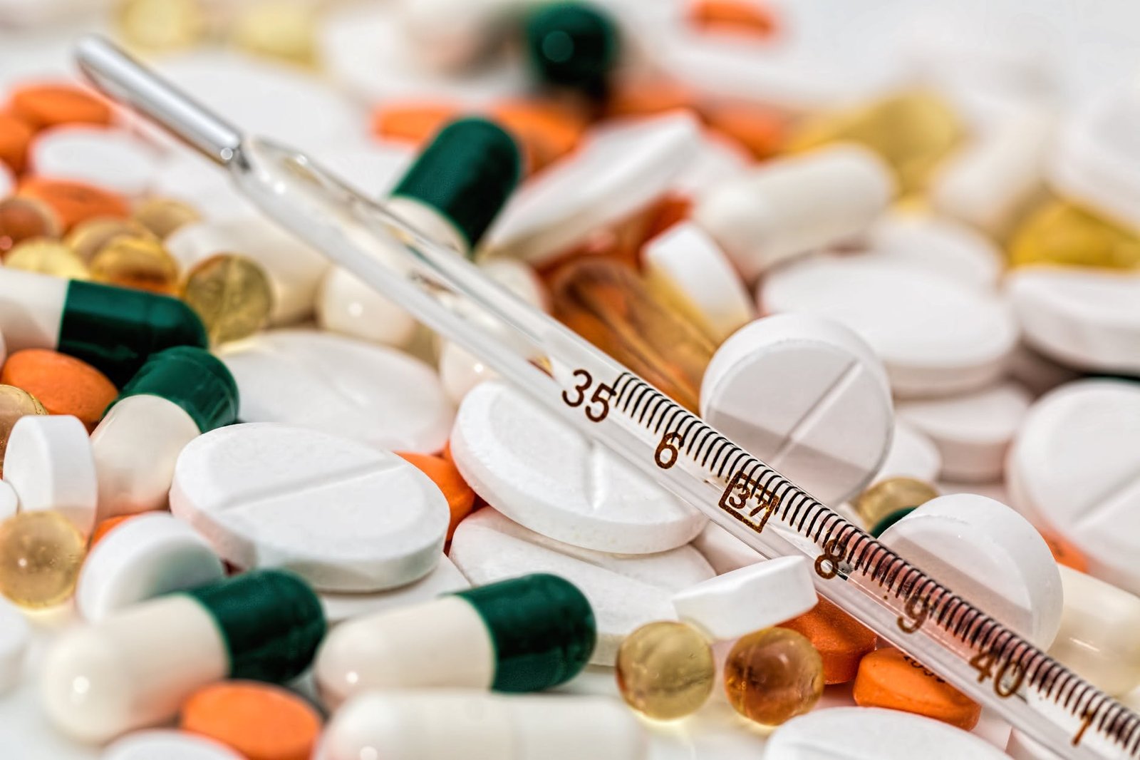 thermometer-headache-pain-pills-139398 thermometer on medical pills